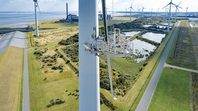 Workers paint a turbine blade black in an effort to deter birds in Eemshaven, the Netherlands. 
