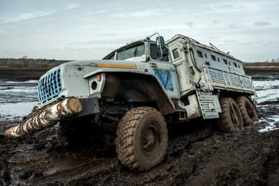 A damaged Russian vehicle mired in wetland in Moshchun, Ukraine, April 2022.