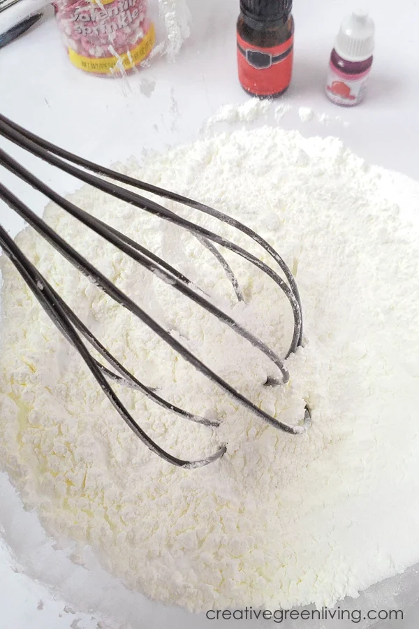 How to make bath bombs with sprinkles - whisk together dry ingredients mix together the dry ingredients to make bath bombs