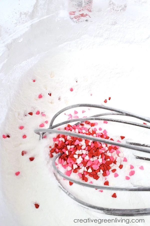 How to add sprinkles to DIY bath bombs you make at home Mix heart sprinkles into the bath bomb mixture