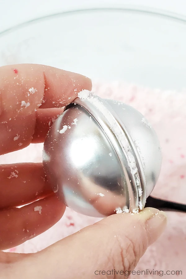 how to make valentine's day bath bombs with heart shaped sprinkles smash two halfs of the bath bombs mold together, press firmly and release