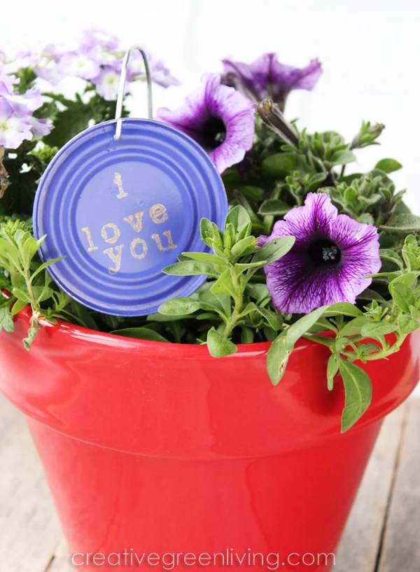 clever recycled craft - turn empty can lid into cute garden art plant marker how to make garden art from recycled materials