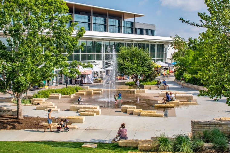 Mueller fountain park and commercial/institutional space.