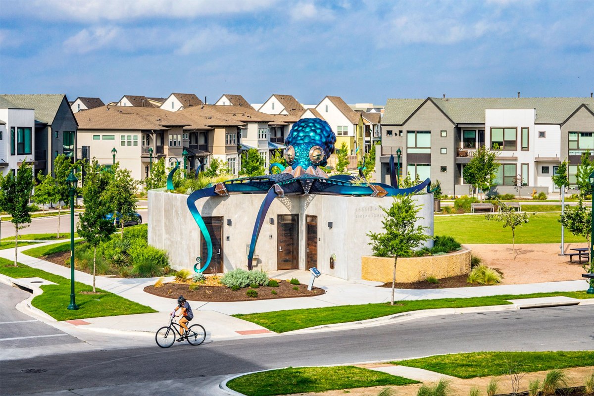Pocket park with octopus sculpture and homes at Mueller