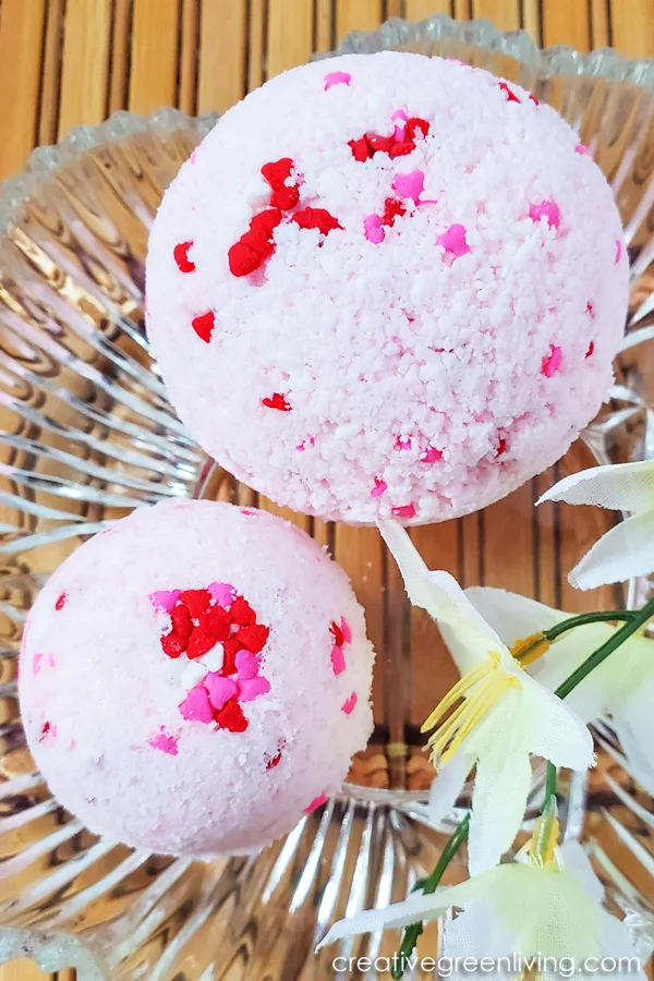 Learn how to make easy DIY bath bombs with essentials oils that smell like candy hearts! These step by step instructions and video makes it simple for beginners to learn how to make bath bombs to give as gifts, keep or to sell. You'll love using natural ingredients like epsom salt to get a Lush quality bath bomb for a lot less money. Learn how to make easy DIY bath bombs with essentials oils that smell like candy hearts! These step by step instructions and video makes it simple for beginners to learn how to make bath bombs to give as gifts, keep or to sell. You'll love using natural ingredients like epsom salt to get a Lush quality bath bomb for a lot less money.