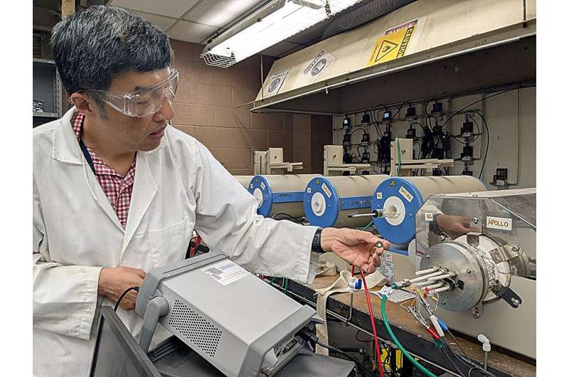 A research team led by Xingbo Liu, a WVU materials engineer, developed a device that can make and store electricity despite intense heat and steam. Their fuel cell design could help build an electric grid capable of adapting to changes in energy supply and demand. Credit: WVU / Micaela Morrissette WVU fuel cell can stabilize power grid by making, storing energy in extreme industrial conditions